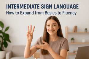 A smiling woman practicing intermediate sign language at home, demonstrating clear hand gestures and facial expressions while learning online.